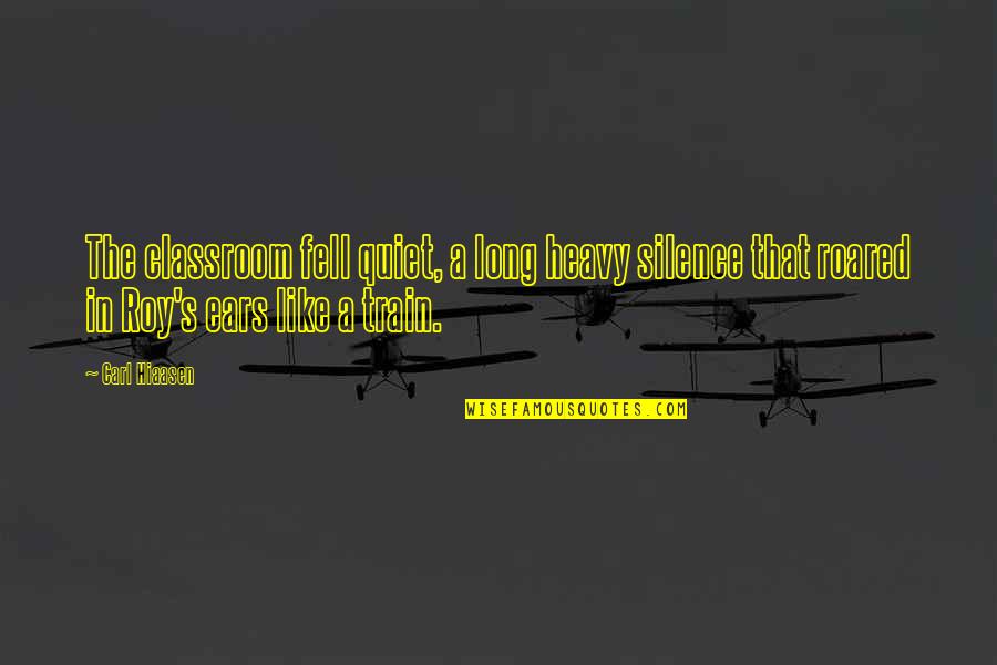 A Simile Quotes By Carl Hiaasen: The classroom fell quiet, a long heavy silence