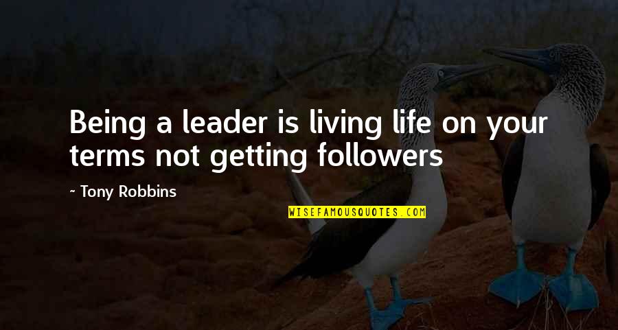 Piktoret E Quotes By Tony Robbins: Being a leader is living life on your