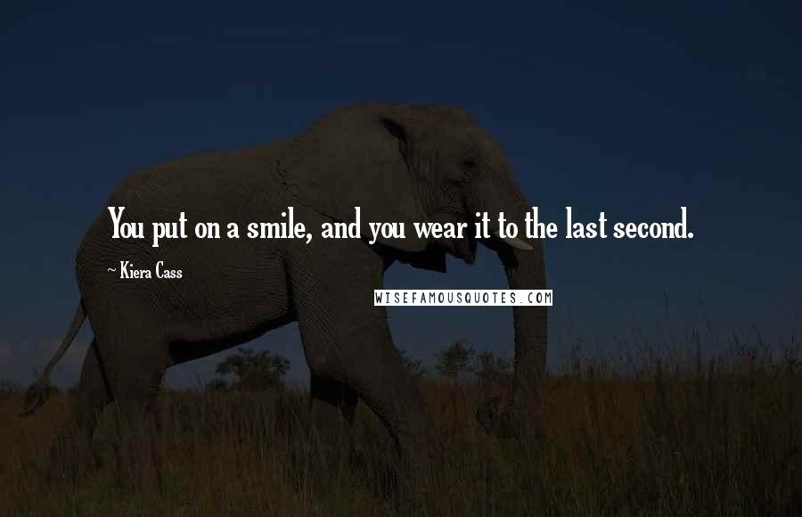 Kiera Cass Quotes: You put on a smile, and you wear it to the last second.