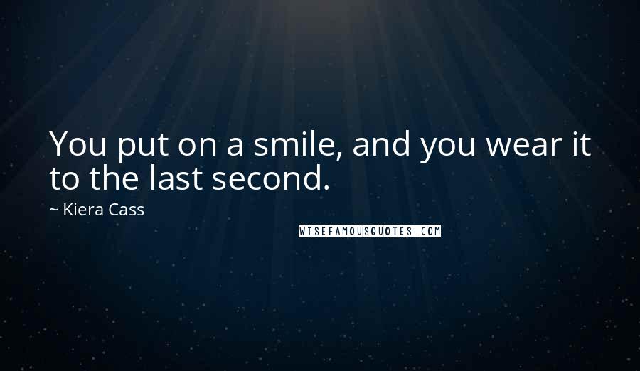 Kiera Cass Quotes: You put on a smile, and you wear it to the last second.